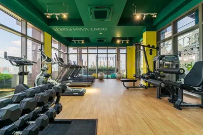 a gym with treadmills and exercise equipment in a building at Delightful Studio Suite in Kuala Lumpur