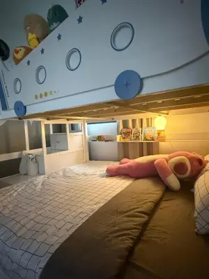 a bedroom with a bed with a doll on it at Modern KL City M vertica condo near MRT, TRX & Sunway Velocity, infinity pool & Parking in Kuala Lumpur
