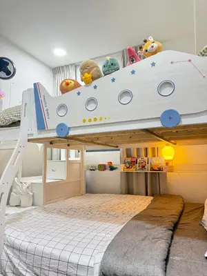 a childs bedroom with a bunk bed with a book shelf at Modern KL City M vertica condo near MRT, TRX & Sunway Velocity, infinity pool & Parking in Kuala Lumpur