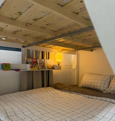 a room with a bed with a light on the ceiling at Modern KL City M vertica condo near MRT, TRX & Sunway Velocity, infinity pool & Parking in Kuala Lumpur