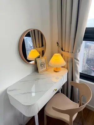 a dressing table with a mirror and a chair at Modern KL City M vertica condo near MRT, TRX & Sunway Velocity, infinity pool & Parking in Kuala Lumpur