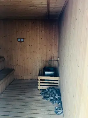 a room with a toilet in a wooden wall at Axon Suite near Pavilion KL by Sky in Kuala Lumpur