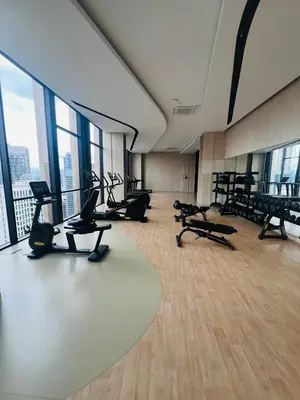 a gym with treadmills and exercise equipment in a building at Axon Suite near Pavilion KL by Sky in Kuala Lumpur
