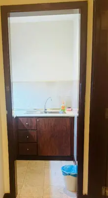 a kitchen with a sink and a window at Times Square Service Suites By Humira in Kuala Lumpur