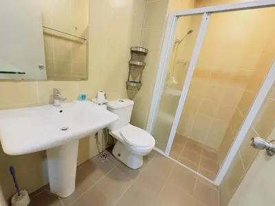 a bathroom with a toilet and a sink and a shower at STANDARD HOME Taragon Puteri Bintang in Kuala Lumpur