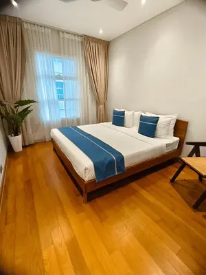 a bedroom with a large bed in a room at Sky Suites KLCC by Global Family Suites in Kuala Lumpur