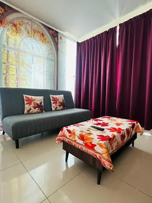 a living room with a couch and a table at Zetapark Setapak Central Mall Home Sweet Home 3 in Kuala Lumpur