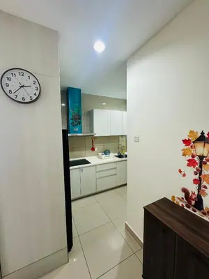 a kitchen with a clock on the wall at Zetapark Setapak Central Mall Home Sweet Home 3 in Kuala Lumpur