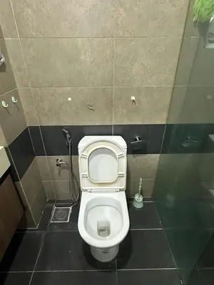 a small bathroom with a toilet in a stall at Zetapark Setapak Central Mall Home Sweet Home 3 in Kuala Lumpur