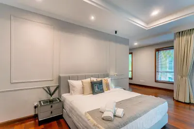 a bedroom with a large bed in a room at 325 Ritchie by COBNB at Ampang in Kuala Lumpur