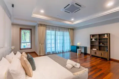 a bedroom with a large white bed and a large window at 325 Ritchie by COBNB at Ampang in Kuala Lumpur