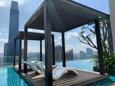 a pavilion on the roof of a building with a pool at Tribeca Homestay Bukit Bintang TRX in Kuala Lumpur