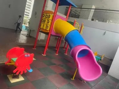 a childrens play area with a slide and a playground at Grand suites at Seri Bukit Ceylon in Kuala Lumpur