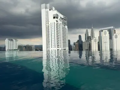 a rendering of a city with a building in the water at Kuala Lumpur Majestic Apartment in Kuala Lumpur