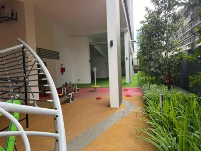 a hallway of a building with plants at Kuala Lumpur Majestic Apartment in Kuala Lumpur