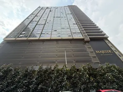 a tall building with a sign on the side of it at Kuala Lumpur Majestic Apartment in Kuala Lumpur
