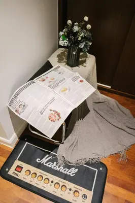 a news paper sitting on top of a table at Chic Cityscape Homestay in Bukit Bintang 1-5 people in Kuala Lumpur
