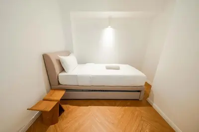 a small bedroom with a bed in a room at Terasek Terrace with Private Pool in Kuala Lumpur
