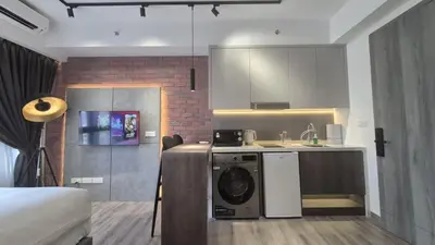 a kitchen with a washing machine in a room at Agile Bukit Bintang TRX 4min MRT Studio Good View Netflix #031 in Kuala Lumpur