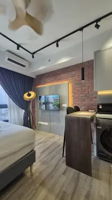 a bedroom with a bed and a living room at Agile Bukit Bintang TRX 4min MRT Studio Good View Netflix #031 in Kuala Lumpur