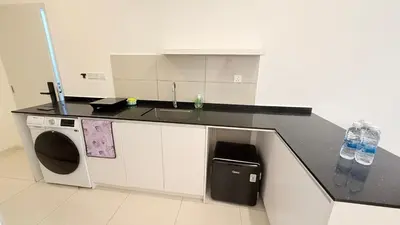 a kitchen with a counter top and a sink at majestic Resort Suites KLCC At Bukit bintang in Kuala Lumpur