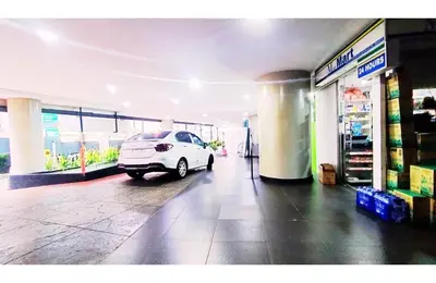 a white car is parked in a garage at Taragon Elite Residence in Kuala Lumpur