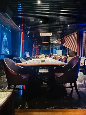 a dining room with a table and chairs at Platinum Suites KLCC by Home stay in Kuala Lumpur