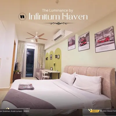a bedroom with a bed and a room with at The Luminance By Infinitum Haven KLCC in Kuala Lumpur