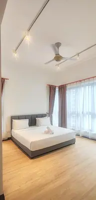 a bedroom with a large bed and a ceiling fan at The Mews KLCC by Luxe Residence in Kuala Lumpur