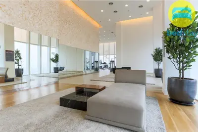 a living room with a couch and a table at Elysian Sky Executive Platinum Suites KLCC in Kuala Lumpur