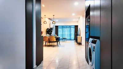a kitchen and dining room with a dining room table at Eaton Residence KLCC - J Home in Kuala Lumpur