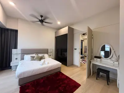 a bedroom with a bed and a ceiling fan at Star Residences in Kuala Lumpur