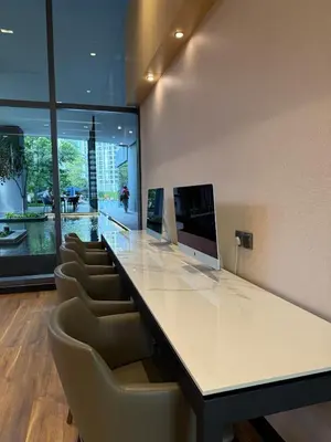 an office with a large white counter and chairs at Star Residence KLCC By Nexus 72 in Kuala Lumpur
