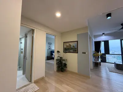 a living room with a hallway with a floor to ceiling window at Star Residance by Nexus in Kuala Lumpur