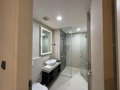 a bathroom with a sink and a glass shower at Star Residance by Nexus in Kuala Lumpur