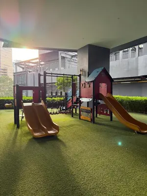 a playground with two slides in a building at Star Residance by Nexus in Kuala Lumpur