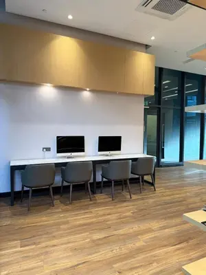 a conference room with chairs and a table with two monitors at Star Residance by Nexus in Kuala Lumpur