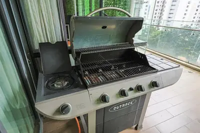 a grill in a kitchen next to a window at The Elements Ampang by Greenhome in Kuala Lumpur