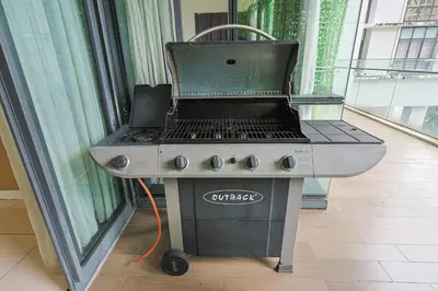 a grill in a room next to a window at The Elements Ampang by Greenhome in Kuala Lumpur