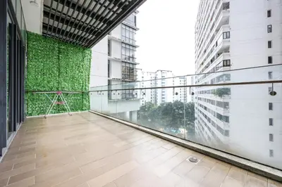 an empty balcony in a building with a green wall at The Elements Ampang by Greenhome in Kuala Lumpur