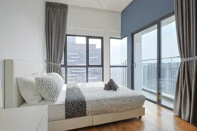 a bedroom with a bed and a large window at Reizz Residence by Greenhome in Kuala Lumpur
