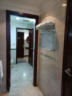 a bathroom with a walk in shower and a toilet at KL Advice Suite At Times Square in Kuala Lumpur