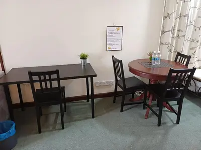 a dining room table with chairs and a table and a table and chairsuggest at KL Advice Suite At Times Square in Kuala Lumpur