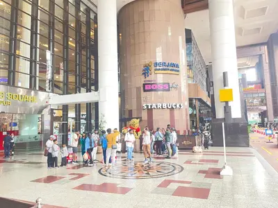 a group of people standing in front of a building at Sunrise Residence At Berjaya Times Square AR in Kuala Lumpur