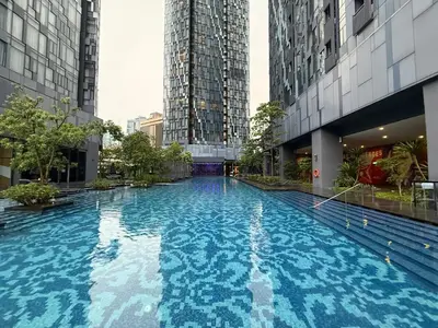 a large swimming pool in a building with tall buildings at KL Star Residance by Nexus 52 in Kuala Lumpur