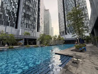 a swimming pool in a city with tall buildings at KL Star Residance by Nexus 52 in Kuala Lumpur