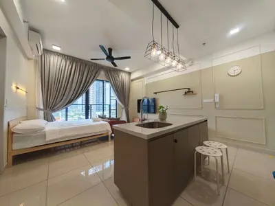 a bathroom with a bed and a sink in a room at TRION The 107 Family Suites POOL VIEW in Kuala Lumpur