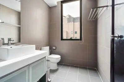 a bathroom with a sink and a toilet at Blueground Kampung Baru pool nr KL Tower KUL-9 in Kuala Lumpur