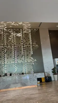 a room with a wall with a bunch of lights at Quill Resort Suites Star House in Kuala Lumpur