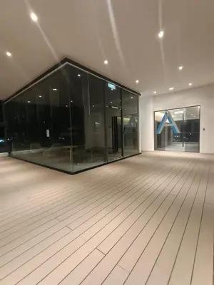 an empty room with a large glass building at Continew Residence by TM House in Kuala Lumpur